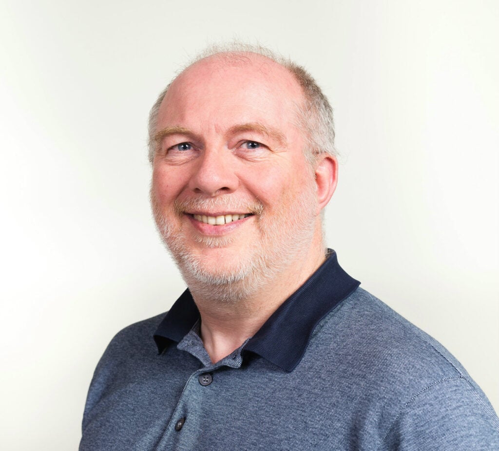 Portrait of a smiling man in a blue polo shirt – John Knight - Cheshire East Active Travel consultation Macclesfield campaign